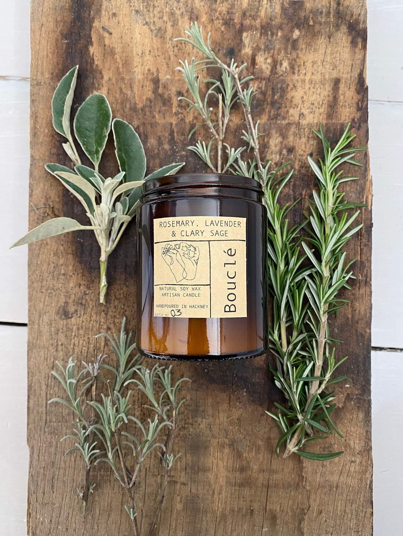 Bouclé Hackney candle surrounded by fresh Rosemary, Lavender & Clary Sage