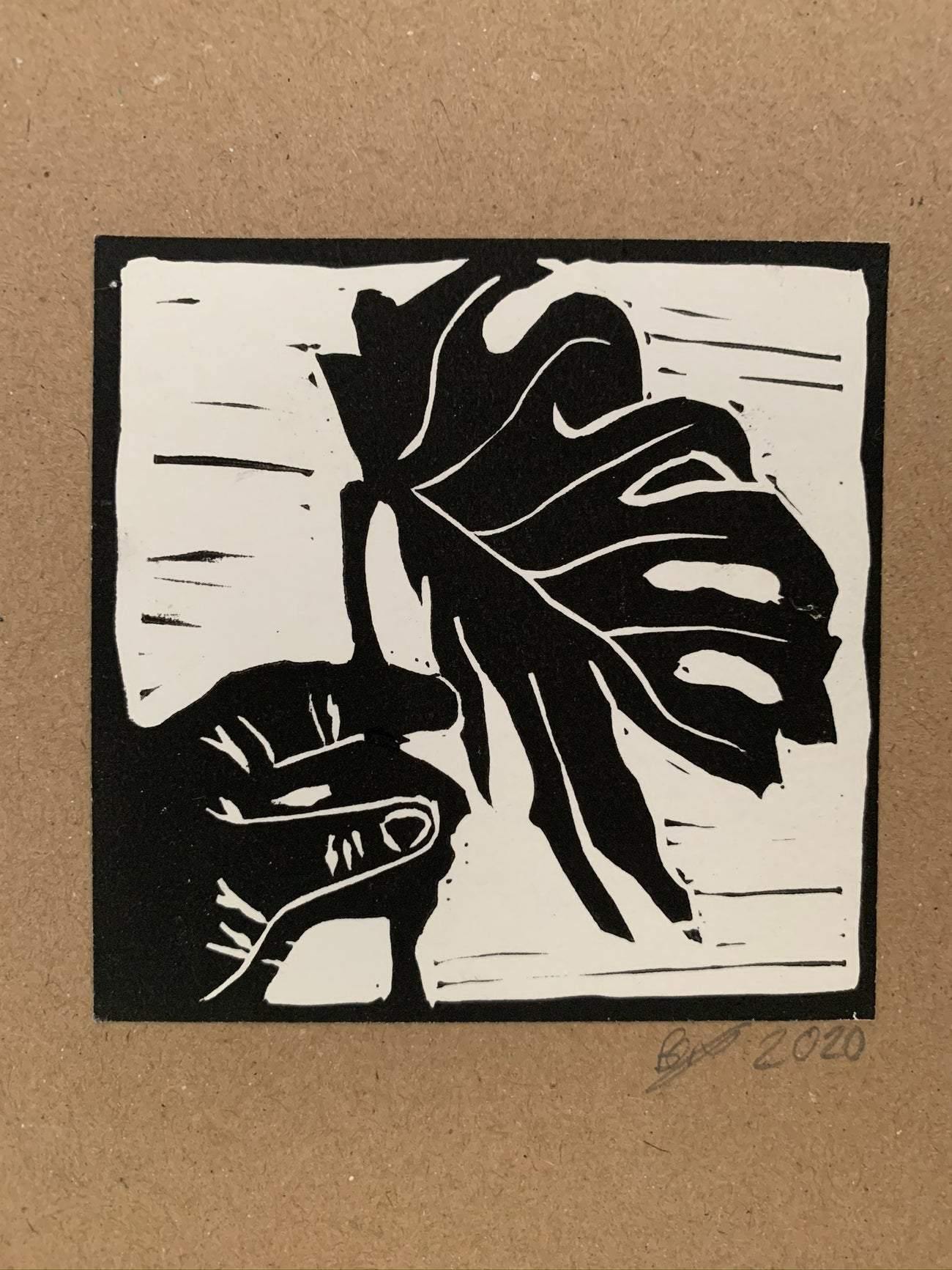Monochrome print of a cheese plant leaf from the greetings card