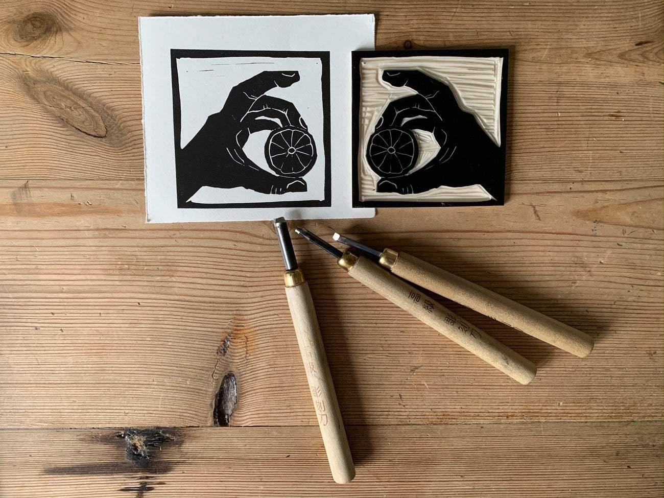 Citrus fruit illustration on lino-cut block process image of the hand printing process.