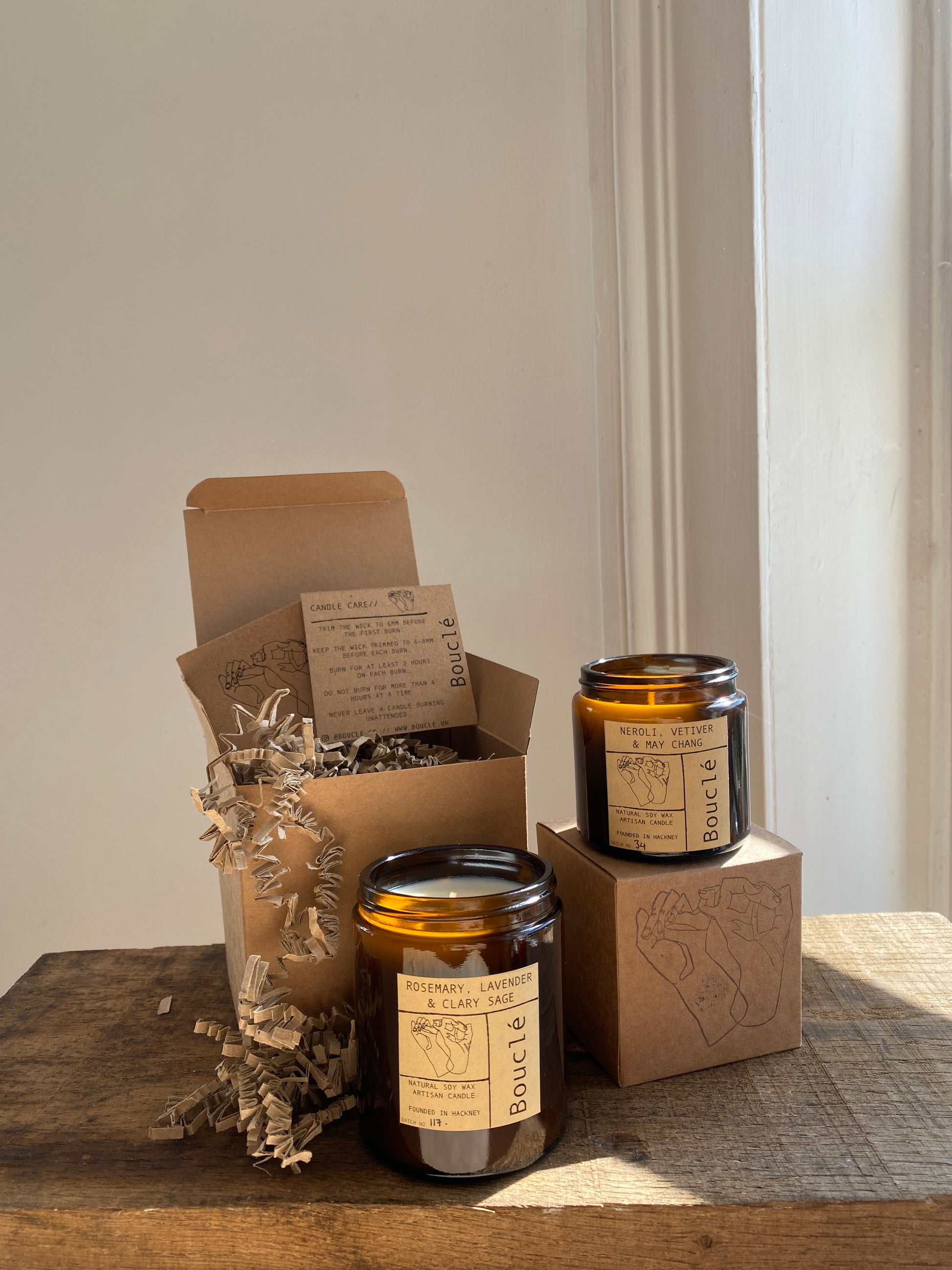 Bouclé London candles in their recycled kraft gift boxes, perfect for gifting. Filled with krinkle cut recycled card and packaged completely plastic free.