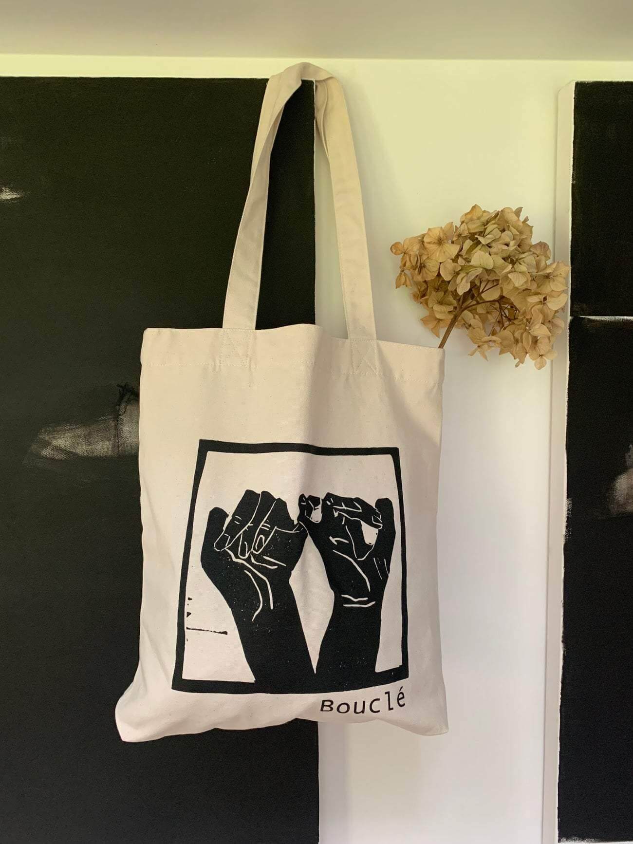 Bouclé shopper bag hanging in an art studio