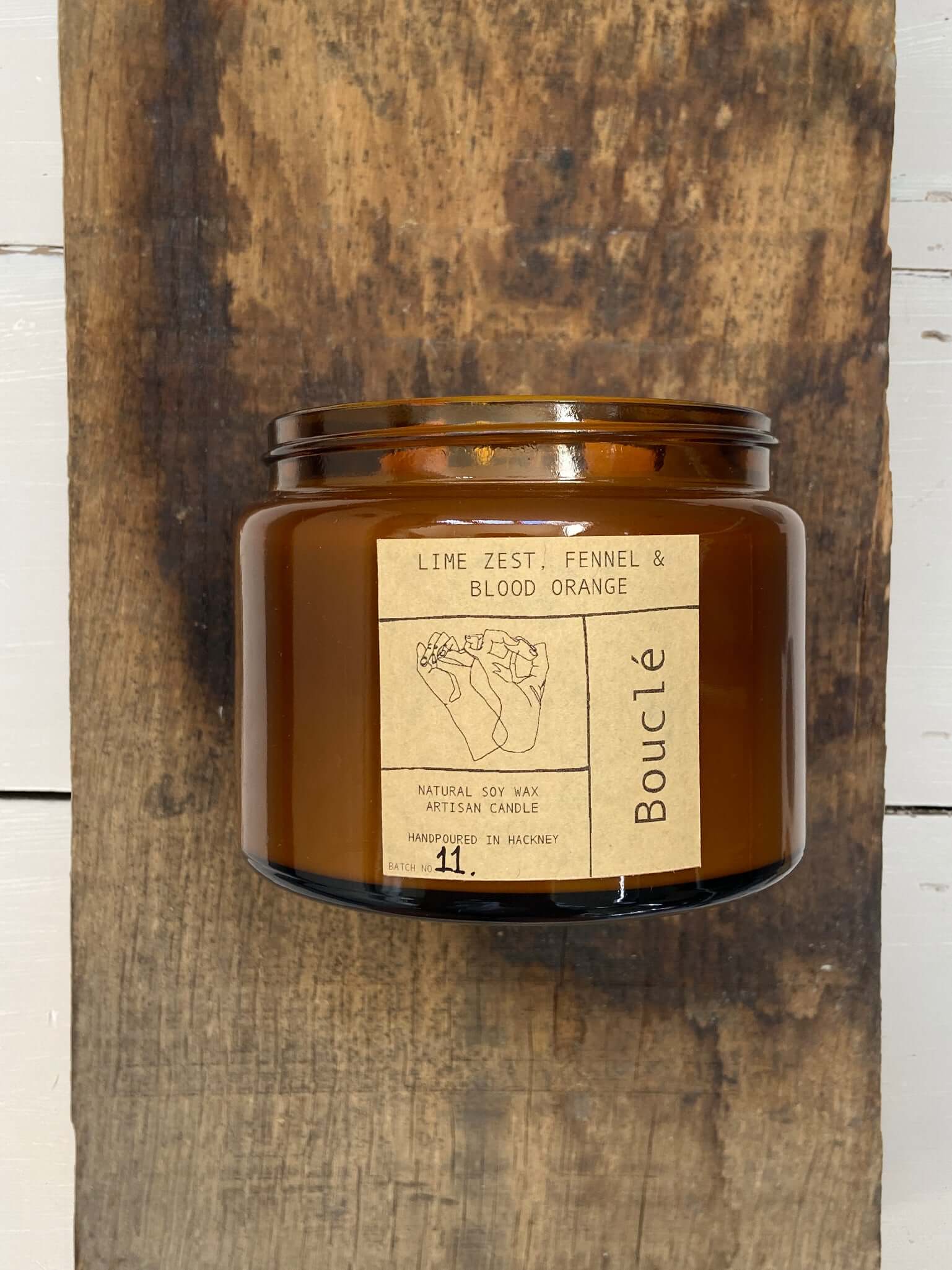 Extra large double wick luxury home fragrance from an all natural essential oil & soy wax candle on wooden board - the perfect gift for her.