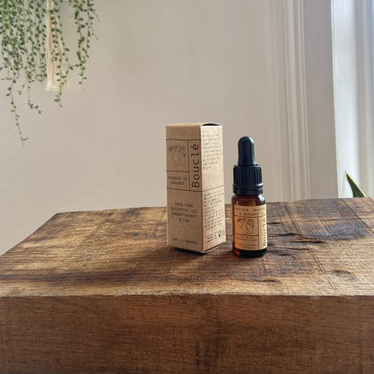 Apothecary style bottle of essential oils with kraft packaging box