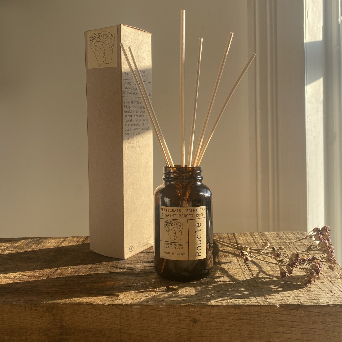 Bouclé London essential oil rattan reed diffuser. Vegan and aromatherapy grade it is in an amber glass bottle.