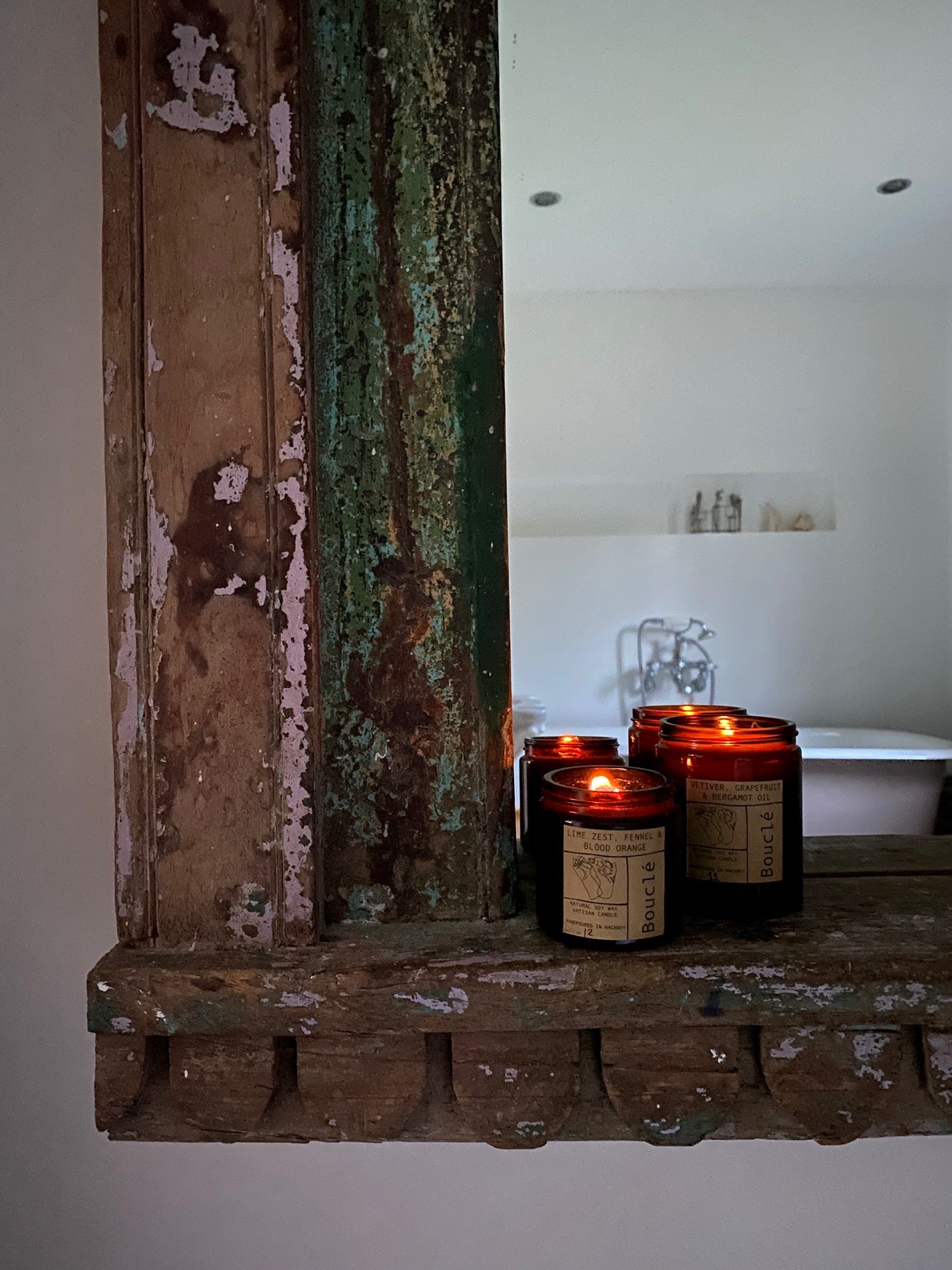 Amber glass jar natural vegan candles, lit on the side creating a cosy home with an all natural aroma