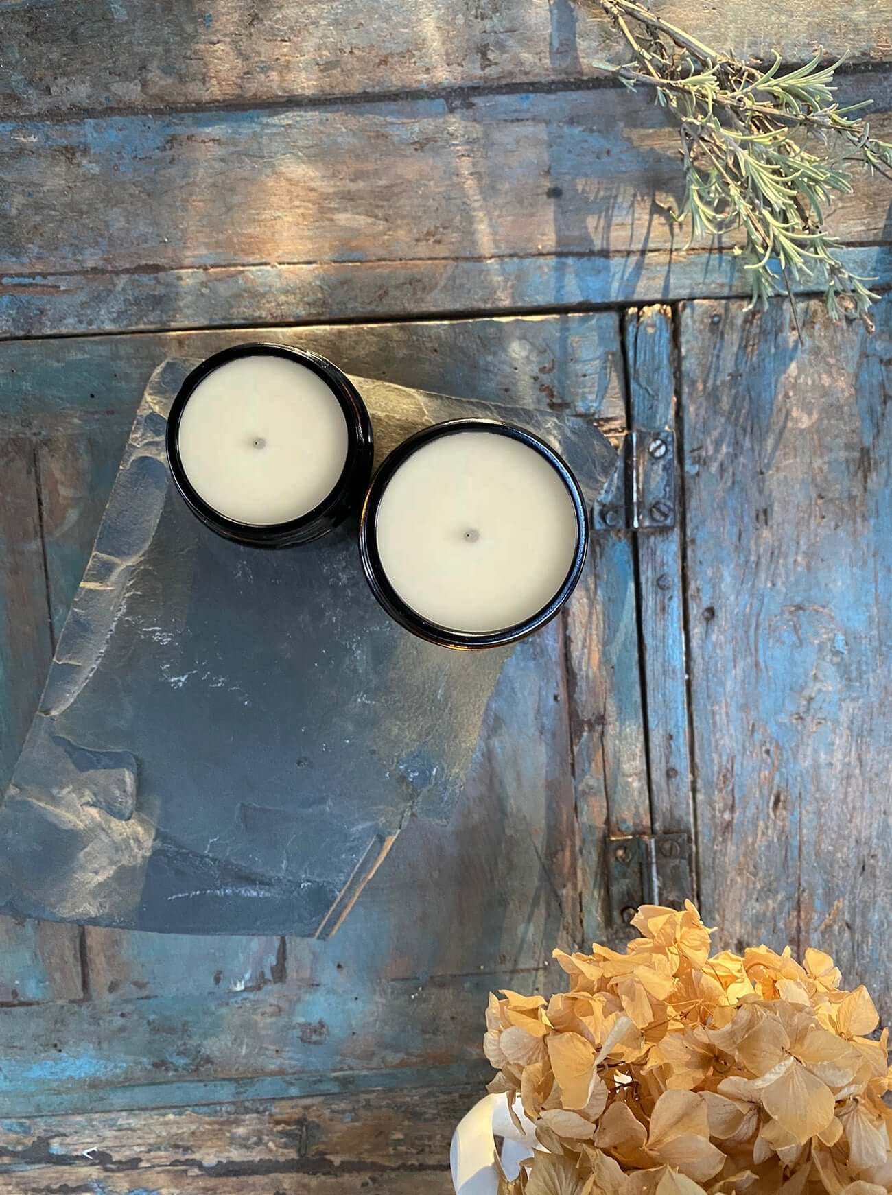 Bouclé London aromatherapy natural candles on coffee table. Made with soy wax, cotton wicks and essential oils this floral candle smells gorgeous.