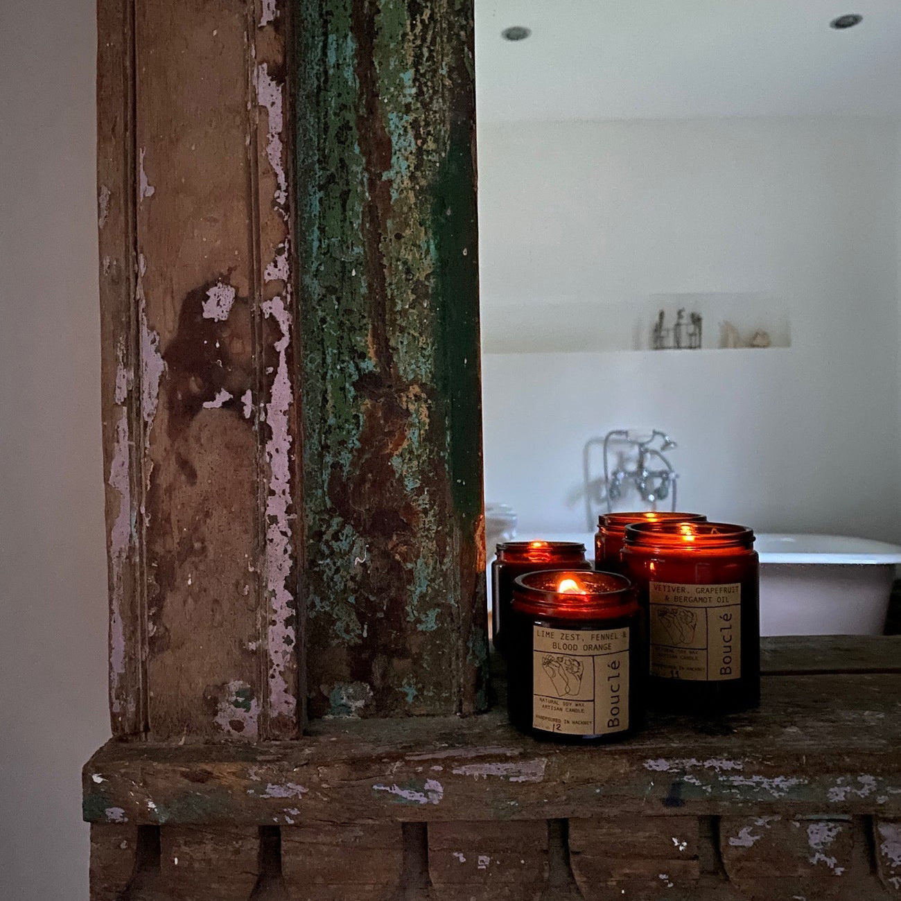 Bouclé candles lit in bathroom setting a relaxing and calming ambience. They smell natural and herbaceous. 