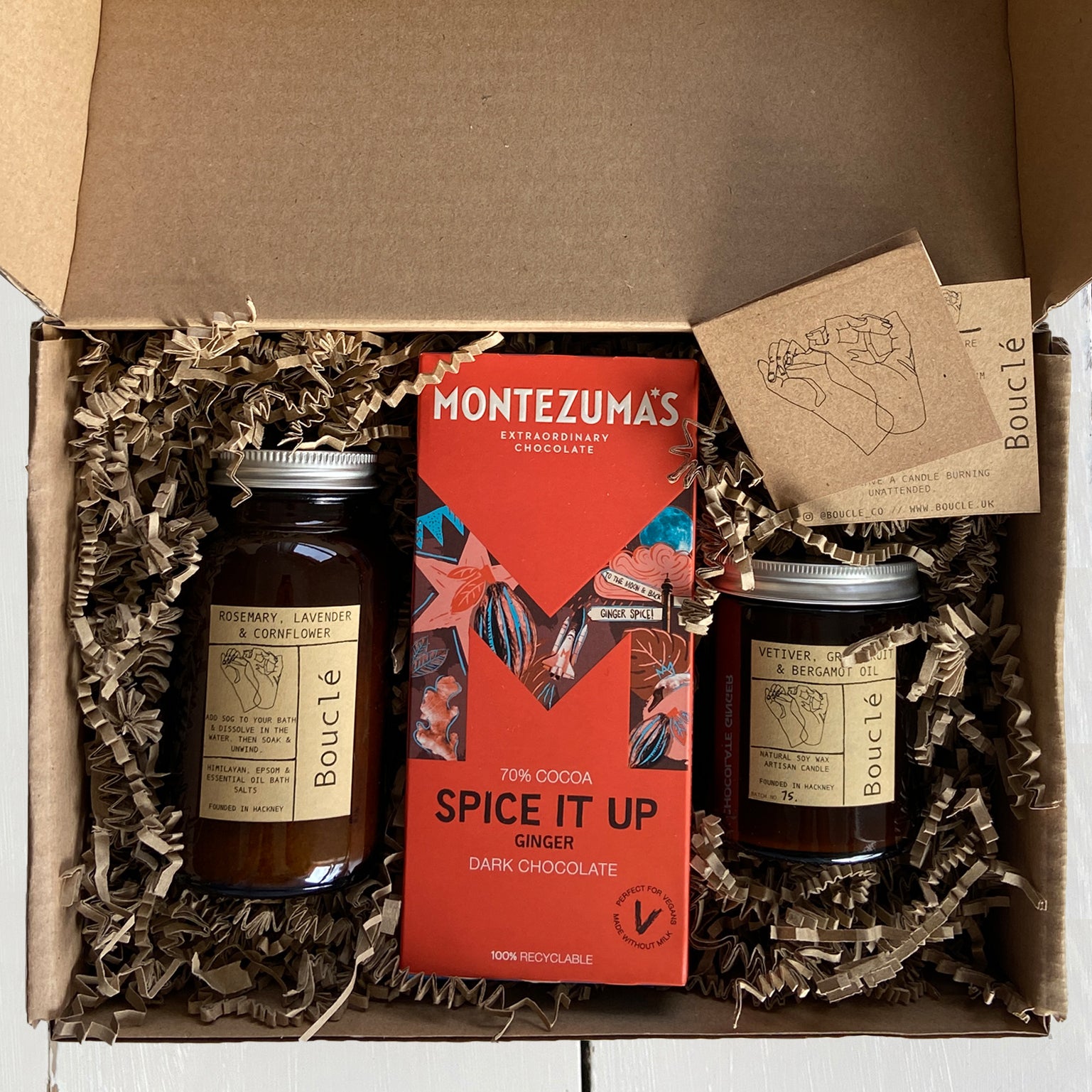 Bouclé London relation gift set including a soy candle, natural calming bath salts & vegan organic chocolate.