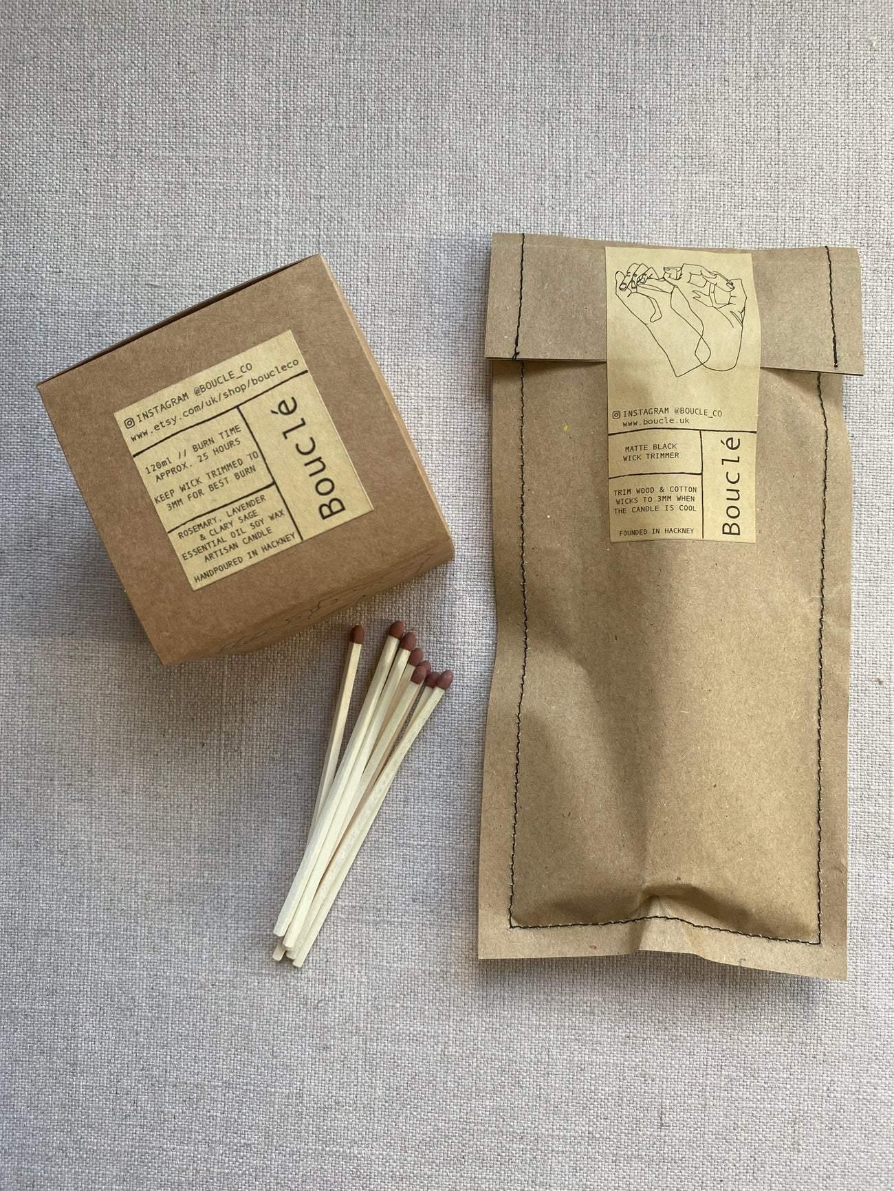 Fully packaged Bouclé London candle with packaged wick trimmer gift set